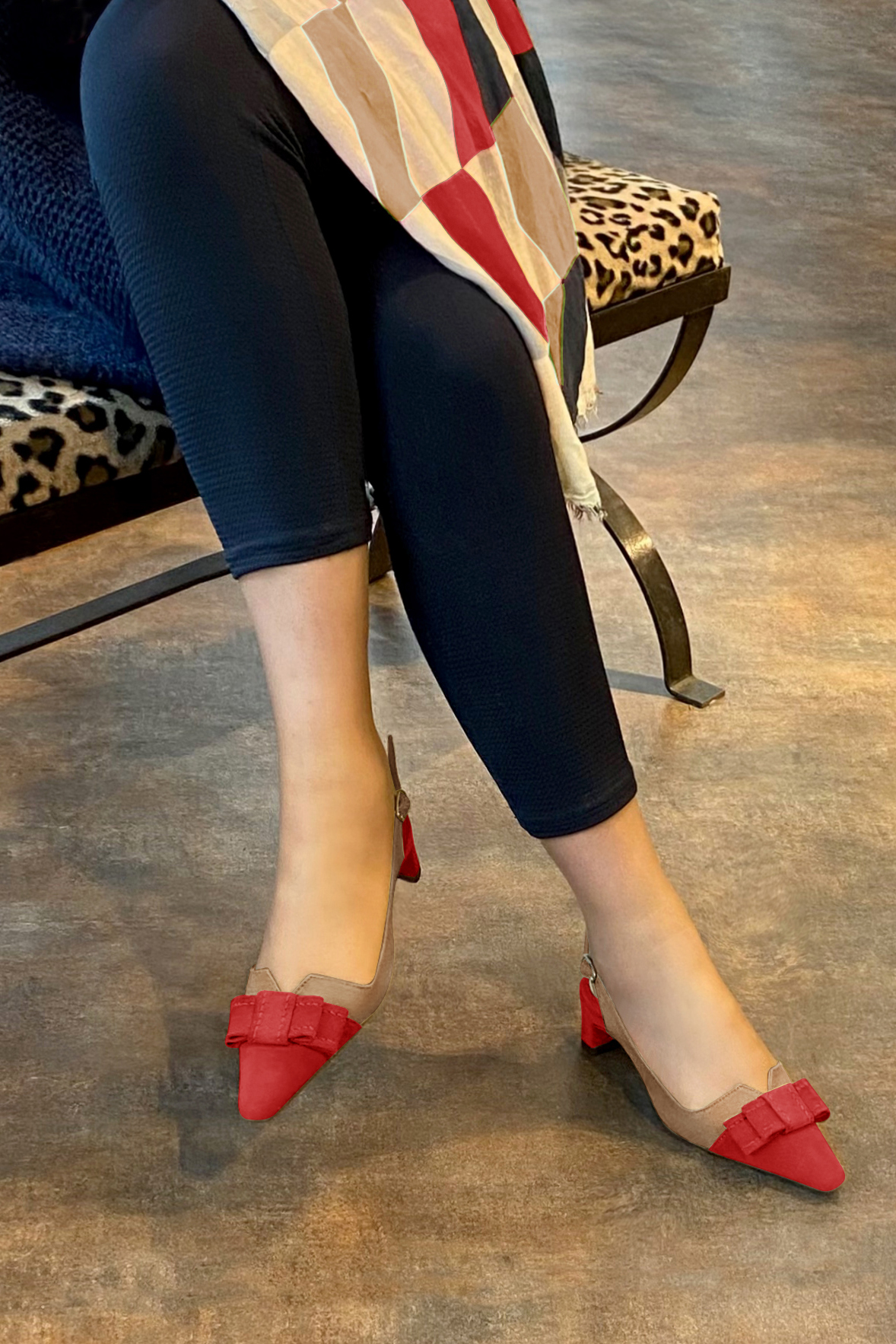 Women's scarlet red and clementine orange elegant slingback heels, with a bow on the front. Tapered toe. Low kitten heels - Worn view